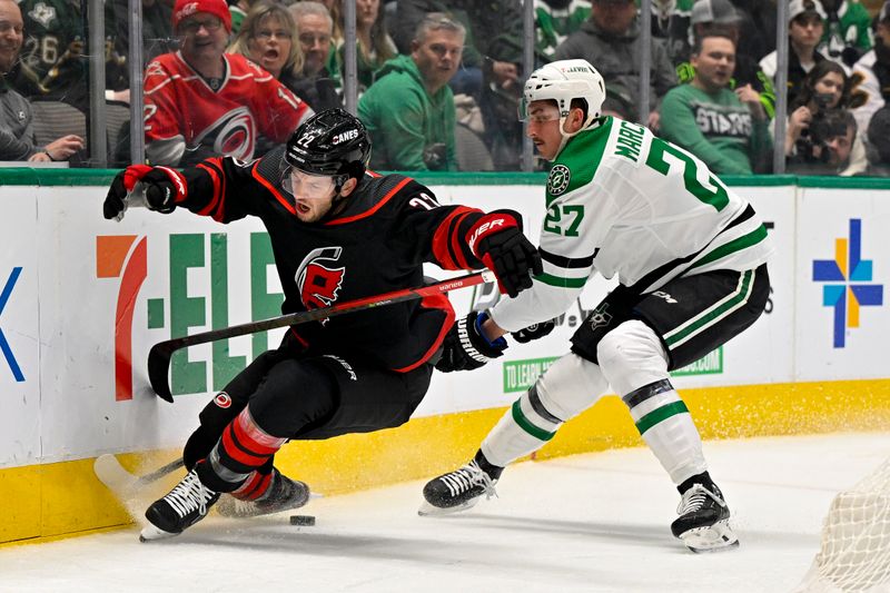 Jan 25, 2023; Dallas, Texas, USA; Carolina Hurricanes defenseman Brett Pesce (22) reacts to being hit with a high stick by Dallas Stars left wing Mason Marchment (27) during the second period at the American Airlines Center. Mandatory Credit: Jerome Miron-USA TODAY Sports