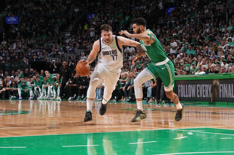 BOSTON, MA - JUNE 17: Luka Doncic #77 of the Dallas Mavericks dribbles the ball during the game against the Boston Celtics during Game 5 of the 2024 NBA Finals on June 17, 2024 at the TD Garden in Boston, Massachusetts. NOTE TO USER: User expressly acknowledges and agrees that, by downloading and or using this photograph, User is consenting to the terms and conditions of the Getty Images License Agreement. Mandatory Copyright Notice: Copyright 2024 NBAE  (Photo by Jesse D. Garrabrant/NBAE via Getty Images)