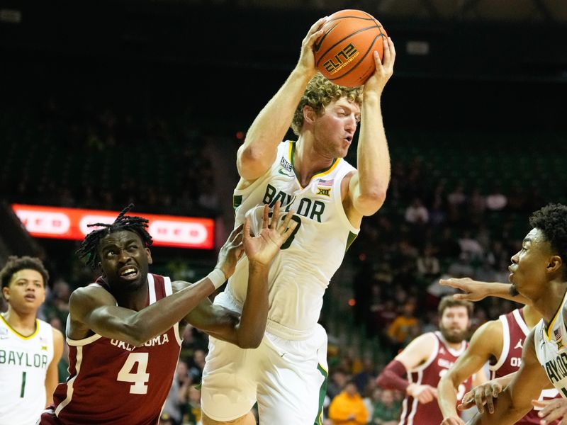 Feb 8, 2023; Waco, Texas, USA;  Baylor Bears forward Caleb Lohner (33) grabs a rebound over Oklahoma Sooners guard Joe Bamisile (4) during the second half at Ferrell Center. Mandatory Credit: Chris Jones-USA TODAY Sports