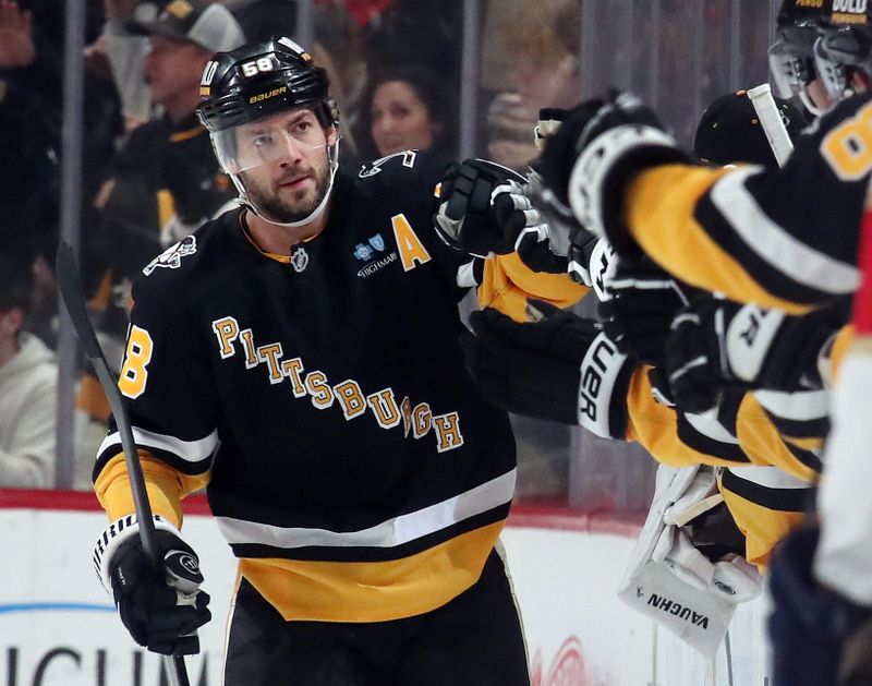 Dec 3, 2024; Pittsburgh, Pennsylvania, USA;  Pittsburgh Penguins defenseman Kris Letang (58) celebrates his goal with the bench against the Florida Panthers during the second period at PPG Paints Arena. Mandatory Credit: Charles LeClaire-Imagn Images