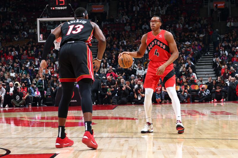 TORONTO, CANADA - DECEMBER 01:  Scottie Barnes #4 of the Toronto Raptors dribbles the ball during the game against the Miami Heat on December 1, 2024 at the Scotiabank Arena in Toronto, Ontario, Canada.  NOTE TO USER: User expressly acknowledges and agrees that, by downloading and or using this Photograph, user is consenting to the terms and conditions of the Getty Images License Agreement.  Mandatory Copyright Notice: Copyright 2024 NBAE (Photo by Vaughn Ridley/NBAE via Getty Images)