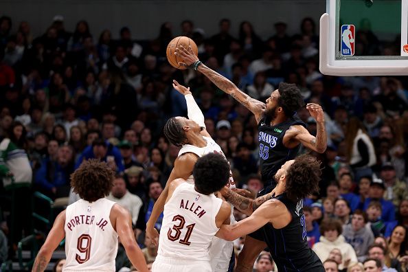 DALLAS, TEXAS - DECEMBER 27: Derrick Jones Jr. #55 of the Dallas Mavericks blocks the shot of Isaac Okoro #35 of the Cleveland Cavaliers in the second half at American Airlines Center on December 27, 2023 in Dallas, Texas. NOTE TO USER: User expressly acknowledges and agrees that, by downloading and or using this photograph, User is consenting to the terms and conditions of the Getty Images License Agreement. (Photo by Tim Heitman/Getty Images)