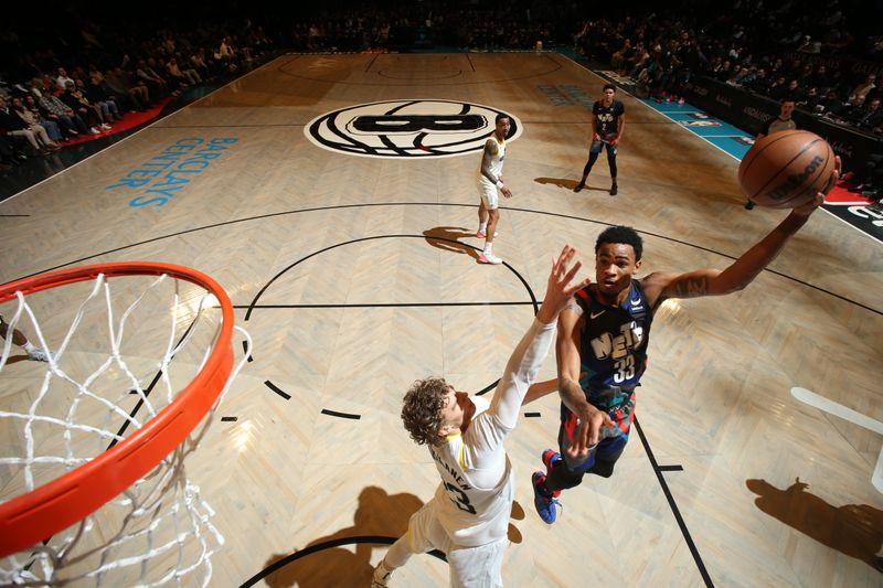 BROOKLYN, NY - JANUARY 29: Nicolas Claxton #33 of the Brooklyn Nets drives to the basket during the game against the Utah Jazz on January 29, 2024 at Barclays Center in Brooklyn, New York. NOTE TO USER: User expressly acknowledges and agrees that, by downloading and or using this Photograph, user is consenting to the terms and conditions of the Getty Images License Agreement. Mandatory Copyright Notice: Copyright 2024 NBAE (Photo by Nathaniel S. Butler/NBAE via Getty Images)