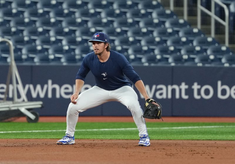 May 31, 2025; Toronto, Ontario, CAN; Toronto Blue Jays third baseman Addison Barger (47) gets ready to field balls during batting practice before a game against the Athletics at Rogers Centre. Mandatory Credit: Nick Turchiaro-Imagn Images