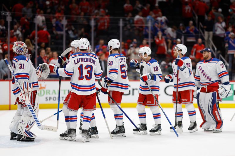 Apr 28, 2024; Washington, District of Columbia, USA; New York Rangers players celebrate after their game against the Washington Capitals in game four of the first round of the 2024 Stanley Cup Playoffs at Capital One Arena. Mandatory Credit: Geoff Burke-USA TODAY Sports