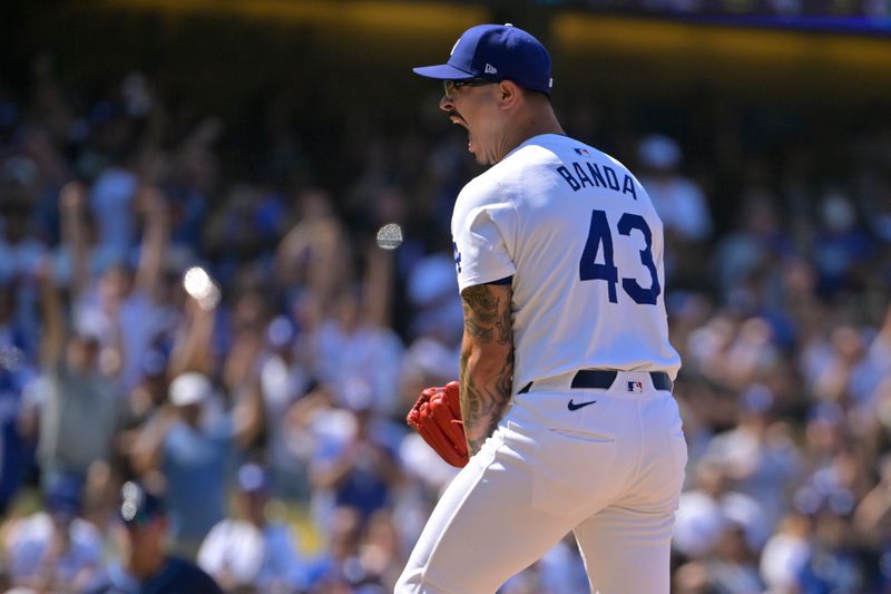 Aug 25, 2024; Los Angeles, California, USA;  Los Angeles Dodgers relief pitcher Anthony Banda (43) reacts after earning a save in the ninth inning against the Tampa Bay Rays at Dodger Stadium. Mandatory Credit: Jayne Kamin-Oncea-USA TODAY Sports
