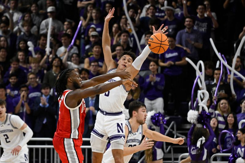 Jan 27, 2024; Evanston, Illinois, USA; Ohio State Buckeyes guard Bruce Thornton (2) passes the ball away from Northwestern Wildcats guard Ty Berry (3) during the second half  at Welsh-Ryan Arena. Mandatory Credit: Matt Marton-USA TODAY Sports