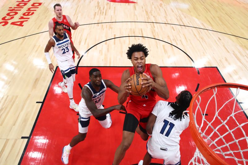 TORONTO, CANADA - OCTOBER 25: Scottie Barnes #4 of the Toronto Raptors jumps to the net for a dunk against Naz Reid #11 of the Minnesota Timberwolves during the first half of their NBA game at Scotiabank Arena on October 25, 2023 in Toronto, Canada. NOTE TO USER: User expressly acknowledges and agrees that, by downloading and or using this photograph, User is consenting to the terms and conditions of the Getty Images License Agreement. (Photo by Cole Burston/Getty Images)