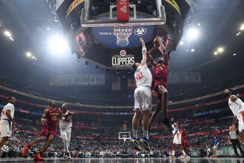 LOS ANGELES, CA - APRIL 7: Evan Mobley #4 of the Cleveland Cavaliers shoots the ball during the game against the LA Clippers on April 7, 2024 at Crypto.Com Arena in Los Angeles, California. NOTE TO USER: User expressly acknowledges and agrees that, by downloading and/or using this Photograph, user is consenting to the terms and conditions of the Getty Images License Agreement. Mandatory Copyright Notice: Copyright 2024 NBAE (Photo by Adam Pantozzi/NBAE via Getty Images)