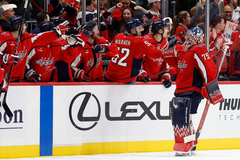 Nov 26, 2025; Washington, District of Columbia, USA; Washington Capitals goaltender Charlie Lindgren (79) celebrates with teammates after their game against the Winnipeg Jets at Capital One Arena. Mandatory Credit: Geoff Burke-Imagn Images