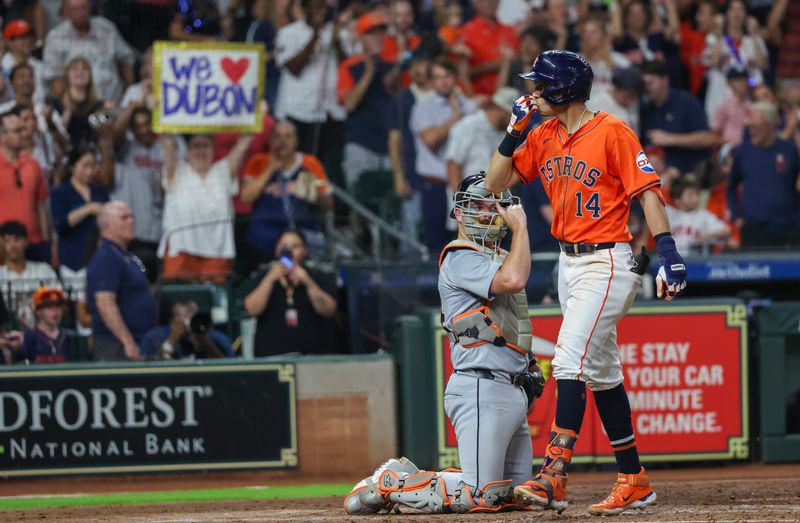 Jun 14, 2024; Houston, Texas, USA; Houston Astros first baseman Mauricio Dubon (14) reacts to his two-run home run against the Detroit Tigers in the sixth inning at Minute Maid Park. Mandatory Credit: Thomas Shea-USA TODAY Sports