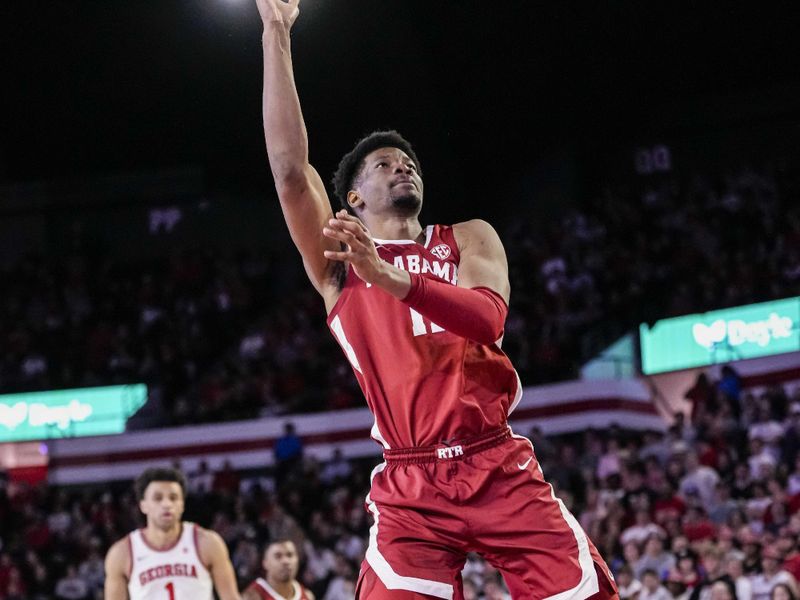 Jan 31, 2024; Athens, Georgia, USA; Alabama Crimson Tide forward Mohamed Wague (11) shoots against the Georgia Bulldogs during the second half at Stegeman Coliseum. Mandatory Credit: Dale Zanine-USA TODAY Sports