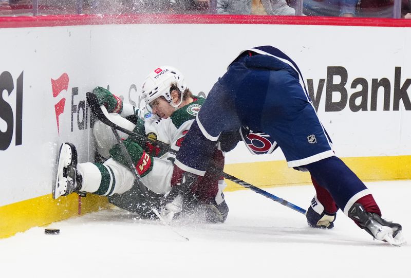 Feb 28, 2025; Denver, Colorado, USA; Colorado Avalanche defenseman Samuel Girard (49) collides into Minnesota Wild left wing Liam Ohgren (28) in the third period at Ball Arena. Mandatory Credit: Ron Chenoy-Imagn Images