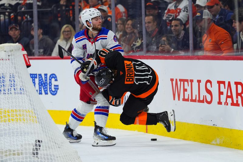 Nov 29, 2024; Philadelphia, Pennsylvania, USA; Philadelphia Flyers right wing Bobby Brink (10) collides with New York Rangers defenseman Zac Jones (6) in the third period at Wells Fargo Center. Mandatory Credit: Kyle Ross-Imagn Images