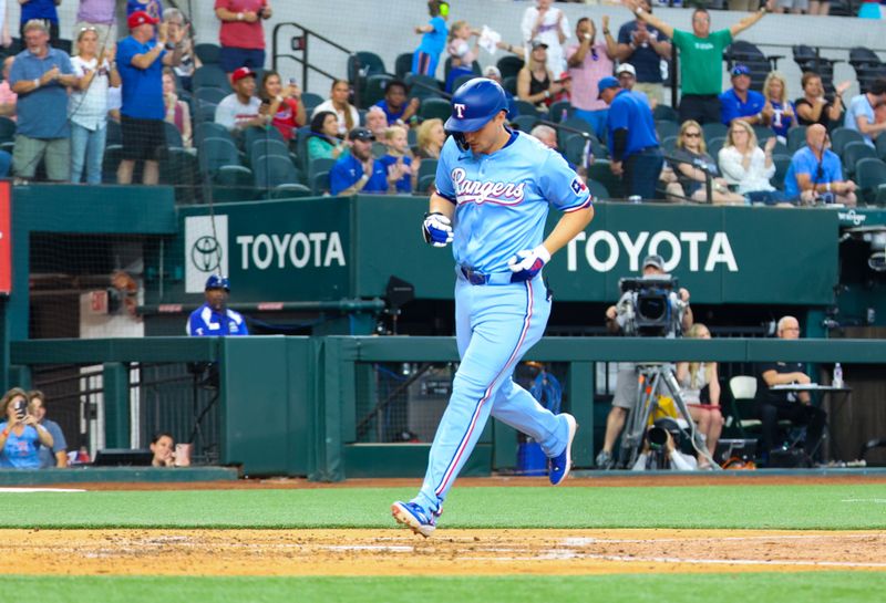 May 19, 2024; Arlington, Texas, USA; Texas Rangers shortstop Corey Seager (5) crosses home plate after hitting a home run during the fourth inning against the Los Angeles Angels at Globe Life Field. Mandatory Credit: Kevin Jairaj-USA TODAY Sports