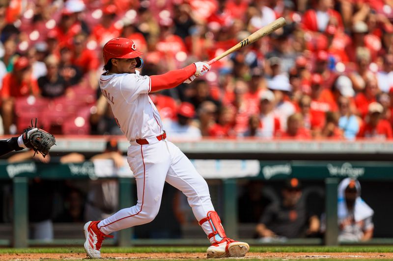 Aug 4, 2024; Cincinnati, Ohio, USA; Cincinnati Reds outfielder Santiago Espinal (4) hits a solo home run in the second inning against the San Francisco Giants at Great American Ball Park. Mandatory Credit: Katie Stratman-USA TODAY Sports