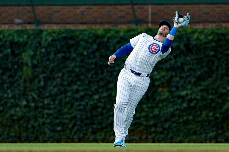 Jul 20, 2024; Chicago, Illinois, USA; Chicago Cubs outfielder Ian Happ (8) catches a fly ball hit by Arizona Diamondbacks outfielder Corbin Carroll (not pictured) during the third inning at Wrigley Field. Mandatory Credit: Kamil Krzaczynski-USA TODAY Sports