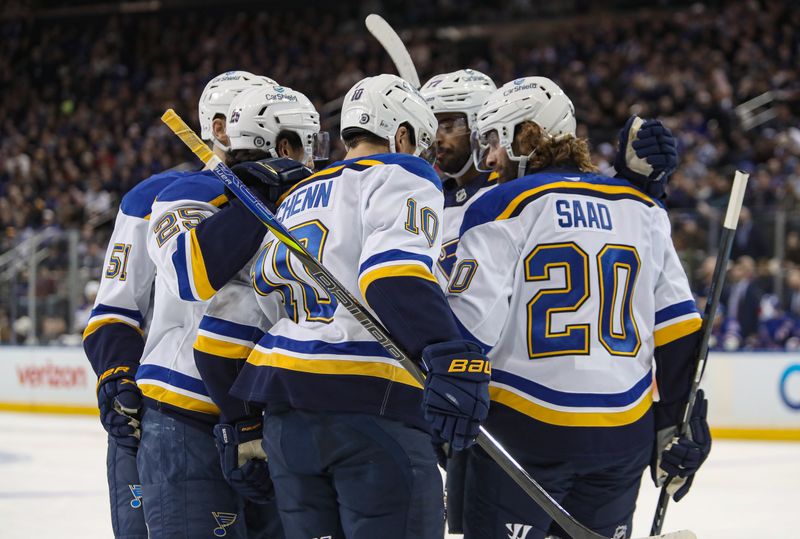 Nov 25, 2024; New York, New York, USA; St. Louis Blues center Jordan Kyrou (25) celebrates his goal against the New York Rangers during the first period at Madison Square Garden. Mandatory Credit: Danny Wild-Imagn Images