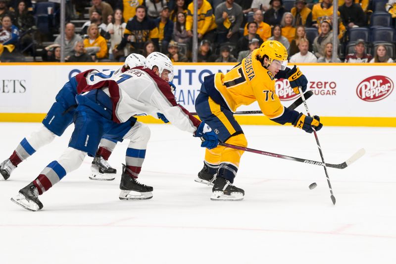 Nov 2, 2024; Nashville, Tennessee, USA;  Colorado Avalanche defenseman Josh Manson (42) and defenseman Devon Toews (7) disrupt the break away of Nashville Predators right wing Luke Evangelista (77) during the third period at Bridgestone Arena. Mandatory Credit: Steve Roberts-Imagn Images