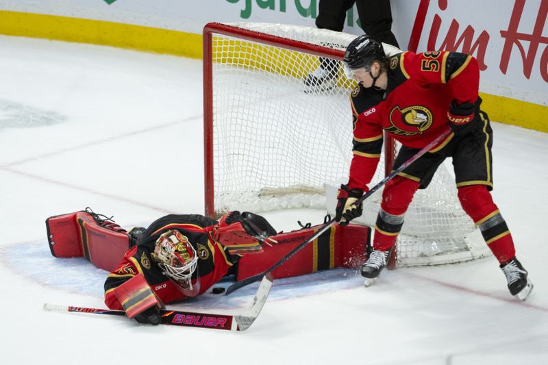 Mar 26, 2026; Ottawa, Ontario, CAN; Ottawa Senators defenseman  Carter Yakemchuk (58) comes to the aid of goalie Linus Ullmark (35) to protect the puck following his save in overtime against the Pittsburgh Penguins at the Canadian Tire Centre. Mandatory Credit: Marc DesRosiers-IMAGN Images