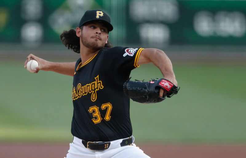 May 22, 2024; Pittsburgh, Pennsylvania, USA;  Pittsburgh Pirates starting pitcher Jared Jones (37) delivers a pitch against the San Francisco Giants during the first inning at PNC Park. Mandatory Credit: Charles LeClaire-USA TODAY Sports