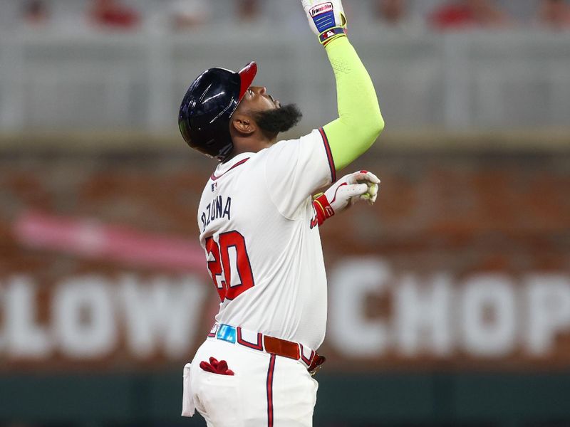 May 30, 2024; Atlanta, Georgia, USA; Atlanta Braves designated hitter Marcell Ozuna (20) celebrates after a ground-rule double against the Washington Nationals in the eighth inning at Truist Park. Mandatory Credit: Brett Davis-USA TODAY Sports
