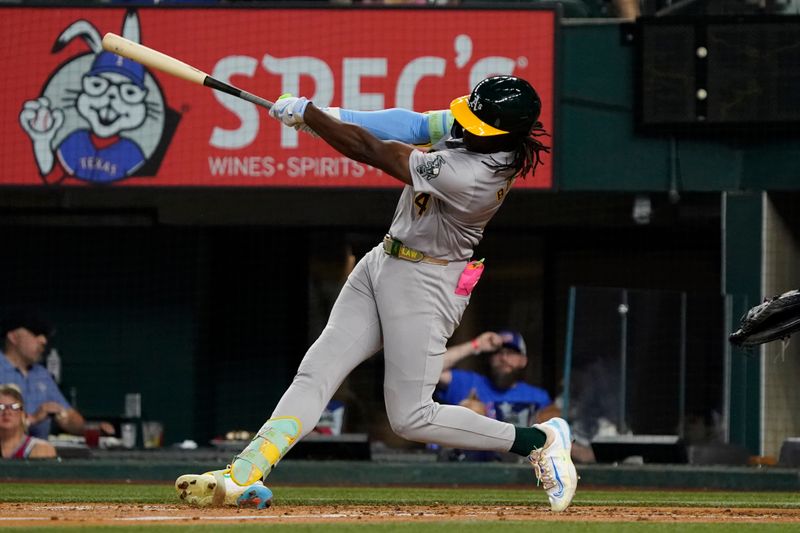 Aug 31, 2024; Arlington, Texas, USA; Oakland Athletics right fielder Lawrence Butler (4) follows through as he hits a solo home run during the fourth inning against the Texas Rangers at Globe Life Field. Mandatory Credit: Raymond Carlin III-USA TODAY Sports