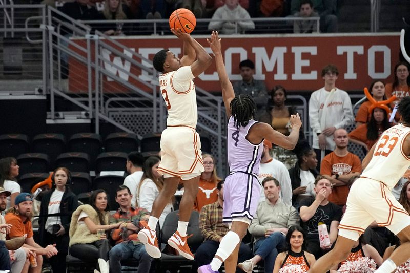 Feb 19, 2024; Austin, Texas, USA; Texas Longhorns guard Max Abmas (3) shoots over Kansas State Wildcats guard Dai Dai Ames (4) during the second half at Moody Center. Mandatory Credit: Scott Wachter-USA TODAY Sports