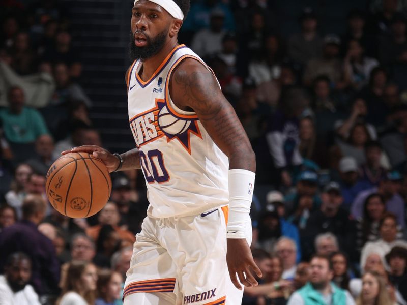 CHARLOTTE, NC - MARCH 15:  Royce O'Neale #00 of the Phoenix Suns handles the ball during the game  on March 15, 2024 at Spectrum Center in Charlotte, North Carolina. NOTE TO USER: User expressly acknowledges and agrees that, by downloading and or using this photograph, User is consenting to the terms and conditions of the Getty Images License Agreement.  Mandatory Copyright Notice:  Copyright 2024 NBAE (Photo by Kent Smith/NBAE via Getty Images)