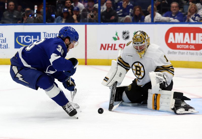 Nov 20, 2023; Tampa, Florida, USA; Tampa Bay Lightning left wing Brandon Hagel (38) skates with puck as Boston Bruins goaltender Jeremy Swayman (1) defends during the first period at Amalie Arena. Mandatory Credit: Kim Klement Neitzel-USA TODAY Sports