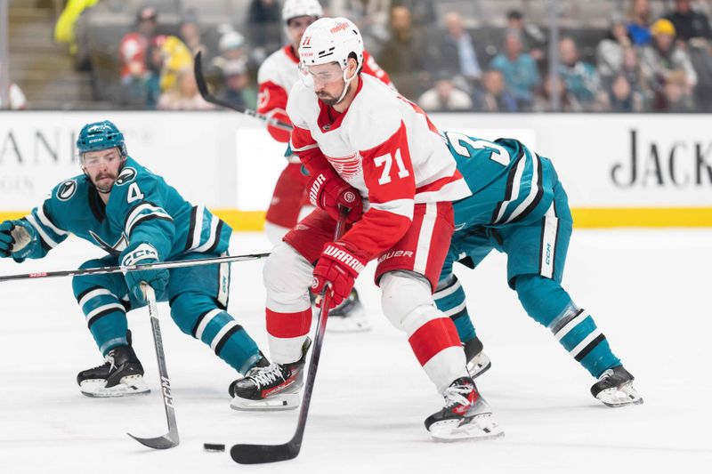 Jan 2, 2024; San Jose, California, USA; Detroit Red Wings center Dylan Larkin (71) prepares to shoot the puck during the first period against San Jose Sharks defenseman Kyle Burroughs (4) at SAP Center at San Jose. Mandatory Credit: Stan Szeto-USA TODAY Sports