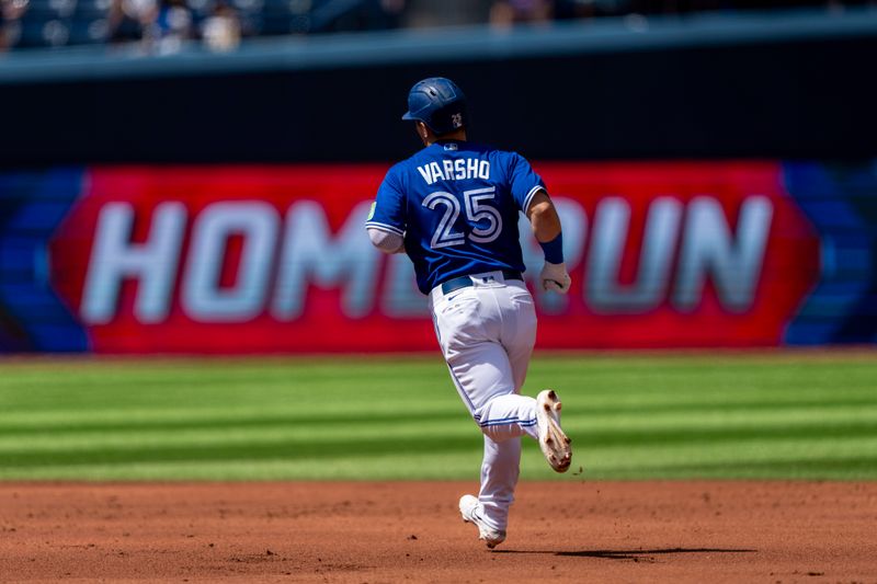 Aug 13, 2023; Toronto, Ontario, CAN; Toronto Blue Jays left fielder Daulton Varsho (25) hits a home run against the Chicago Cubs during the second inning at Rogers Centre. Mandatory Credit: Kevin Sousa-USA TODAY Sports