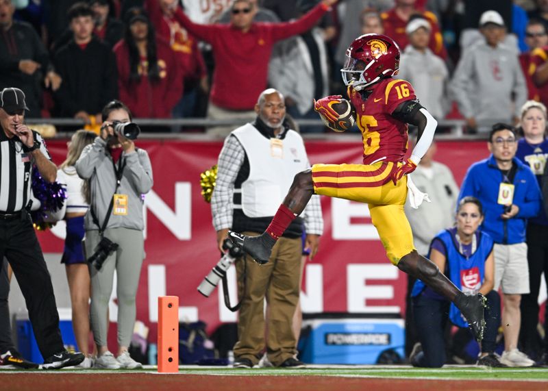 Nov 4, 2023; Los Angeles, California, USA; USC Trojans wide receiver Tahj Washington (16) jumps into the end but does not score due to a penalty in favor of the Washington Huskies during the fourth quarter at United Airlines Field at Los Angeles Memorial Coliseum. Mandatory Credit: Jonathan Hui-USA TODAY Sports