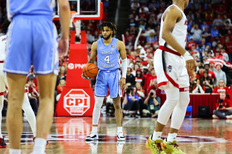 Feb 19, 2023; Raleigh, North Carolina, USA;  North Carolina Tar Heels forward Armando Bacot (5) looks on during the second half of the game against North Carolina State Wolfpack at PNC Arena. Mandatory Credit: Jaylynn Nash-USA TODAY Sports