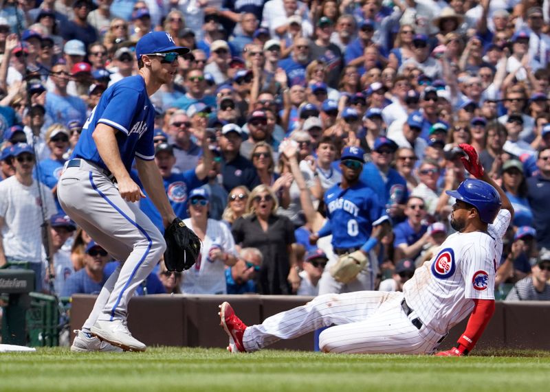 Aug 19, 2023; Chicago, Illinois, USA; Chicago Cubs third baseman Jeimer Candelario (9) is safe at third base with a triple as Kansas City Royals third baseman Matt Duffy (15) waits for  throw during the second inning at Wrigley Field. Mandatory Credit: David Banks-USA TODAY Sports