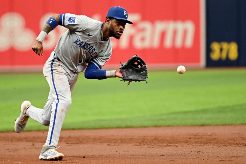May 26, 2024; St. Petersburg, Florida, USA; Kansas City Royals third baseman Maikel Garcia (11) fields a ground ball in the third inning against the Tampa Bay Rays at Tropicana Field. Mandatory Credit: Jonathan Dyer-USA TODAY Sports