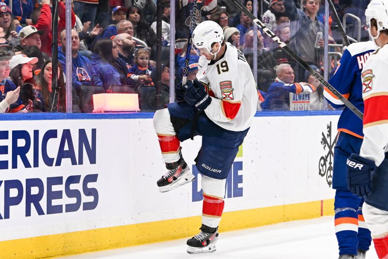 Jan 27, 2024; Elmont, New York, USA; Florida Panthers left wing Matthew Tkachuk (19) celebrates his goal against the New York Islanders during the third period at UBS Arena. Mandatory Credit: Dennis Schneidler-USA TODAY Sports