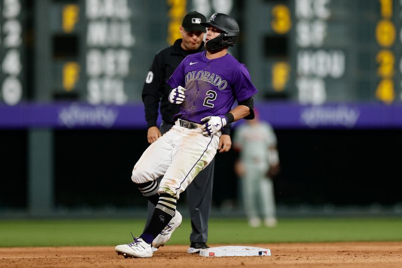 May 20, 2025; Denver, Colorado, USA; Colorado Rockies right fielder Tyler Freeman (2) reaches second on a double in the seventh inning against the Philadelphia Phillies at Coors Field. Mandatory Credit: Isaiah J. Downing-Imagn Images