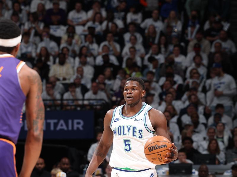 MINNEAPOLIS, MN -  APRIL 20: Anthony Edwards #5 of the Minnesota Timberwolves dribbles the ball during the game against the Phoenix Suns during Round 1 Game 1 of the 2024 NBA Playoffs on April 20, 2024 at Target Center in Minneapolis, Minnesota. NOTE TO USER: User expressly acknowledges and agrees that, by downloading and or using this Photograph, user is consenting to the terms and conditions of the Getty Images License Agreement. Mandatory Copyright Notice: Copyright 2024 NBAE (Photo by David Sherman/NBAE via Getty Images)