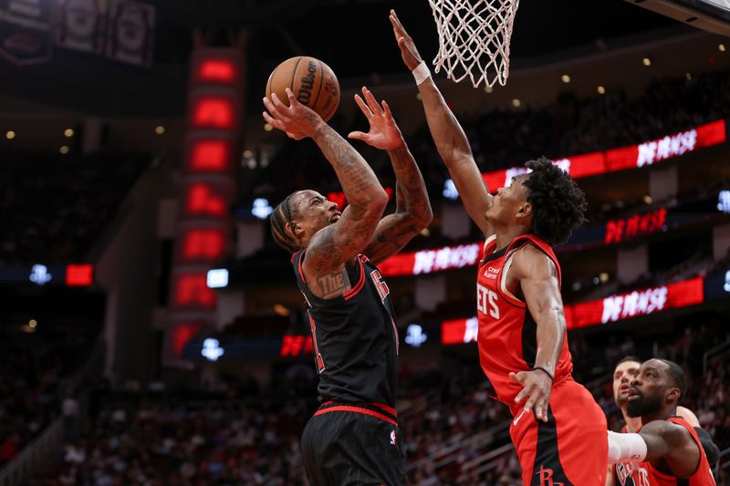 HOUSTON, TEXAS - MARCH 21: DeMar DeRozan #11 of the Chicago Bulls goes up for a shot against Amen Thompson #1 of the Houston Rockets in the second half at Toyota Center on March 21, 2024 in Houston, Texas.  NOTE TO USER: User expressly acknowledges and agrees that, by downloading and or using this photograph, User is consenting to the terms and conditions of the Getty Images License Agreement. (Photo by Tim Warner/Getty Images)