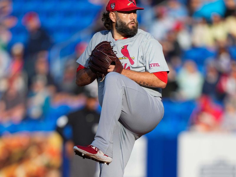 Mar 19, 2024; Port St. Lucie, Florida, USA; St. Louis Cardinals starting pitcher Lance Lynn (31) throws a pitch against the New York Mets during the first inning at Clover Park. Mandatory Credit: Rich Storry-USA TODAY Sports