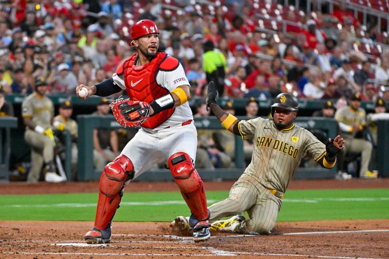 Aug 26, 2024; St. Louis, Missouri, USA;  St. Louis Cardinals catcher Ivan Herrera (48) forces out San Diego Padres designated hitter Luis Arraez (4) during the third inning at Busch Stadium. Mandatory Credit: Jeff Curry-USA TODAY Sports