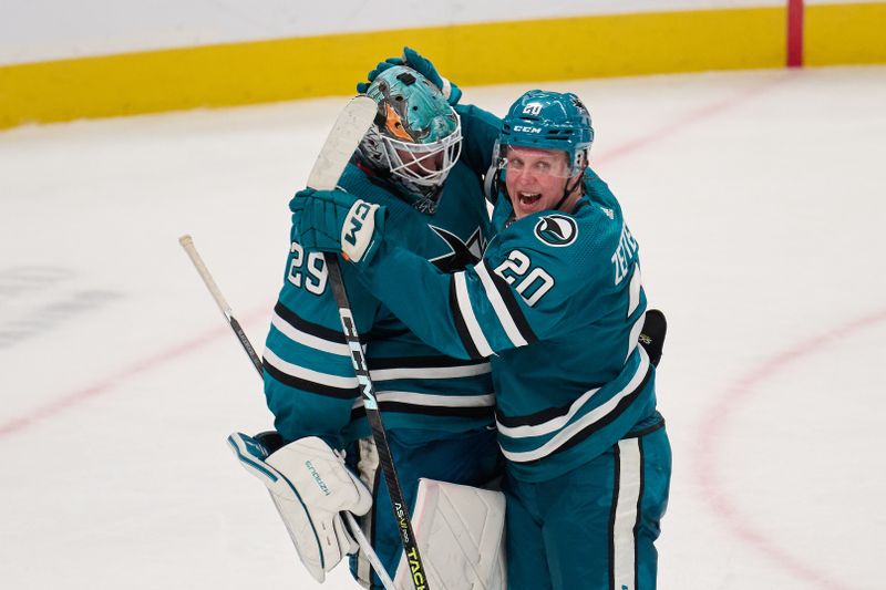 Dec 12, 2023; San Jose, California, USA; San Jose Sharks left wing Fabian Zetterlund (20) congratulates goaltender Mackenzie Blackwood (29) after the Sharks defeated the Winnipeg Jets at SAP Center at San Jose. Mandatory Credit: Robert Edwards-USA TODAY Sports