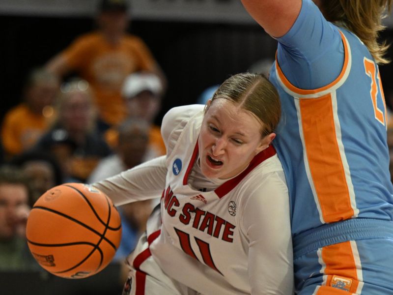 Mar 25, 2024; Raleigh, North Carolina, USA; NC State Wolfpack forward Maddie Cox (11) drives the baseline in the second round of the 2024 NCAA Women's Tournament at James T. Valvano Arena at William Neal Reynolds. Mandatory Credit: William Howard-USA TODAY Sports