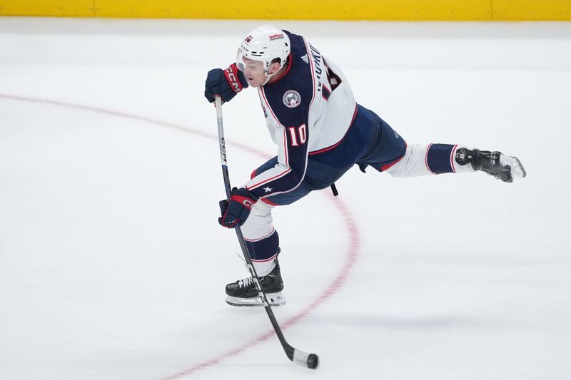 Feb 17, 2024; San Jose, California, USA; Columbus Blue Jackets left wing Dmitri Voronkov (10) shoots against the San Jose Sharks during the third period at SAP Center at San Jose. Mandatory Credit: Darren Yamashita-USA TODAY Sports