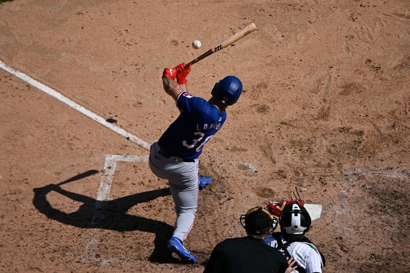 Aug 29, 2024; Chicago, Illinois, USA;  Texas Rangers outfielder Wyatt Langford (36) grounds out and a run scores against the Chicago White Sox during the seventh inning at Guaranteed Rate Field. Mandatory Credit: Matt Marton-USA TODAY Sports