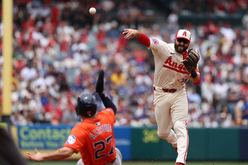 Jun 9, 2024; Anaheim, California, USA;  Los Angeles Angels second baseman Michael Stefanic (38) throws to first after a getting Houston Astros second baseman Jose Altuve (27) out at second to complete a double-play during the first inning at Angel Stadium. Mandatory Credit: Kiyoshi Mio-USA TODAY Sports