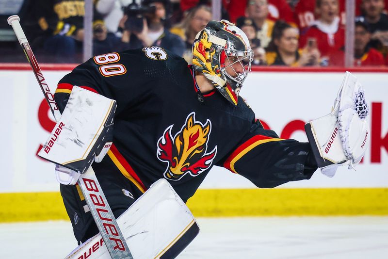 Feb 28, 2023; Calgary, Alberta, CAN; Calgary Flames goaltender Dan Vladar (80) makes a save against the Boston Bruins during the first period at Scotiabank Saddledome. Mandatory Credit: Sergei Belski-USA TODAY Sports