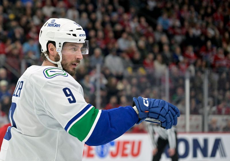 Jan 6, 2025; Montreal, Quebec, CAN; Vancouver Canucks forward J.T. Miller (9) prepares for a face off against the Montreal Canadiens during the second period at the Bell Centre. Mandatory Credit: Eric Bolte-Imagn Images