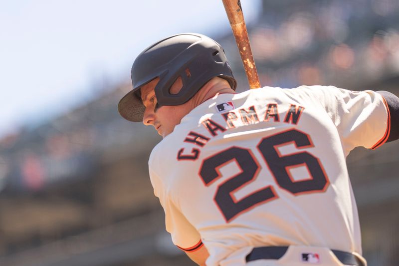 Sep 5, 2024; San Francisco, California, USA;  San Francisco Giants third base Matt Chapman (26) warms up at the on-deck circle during the first inning against the Arizona Diamondbacks at Oracle Park. Mandatory Credit: Stan Szeto-Imagn Images